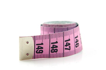 Pink measure tape over white background