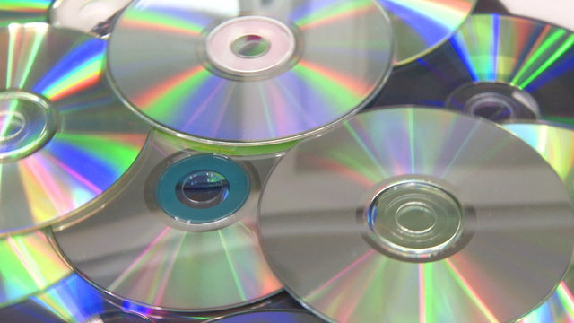 CD DVD rotating on white background