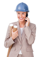 Charming female architect on phone standing