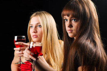 Two young women in a bar.