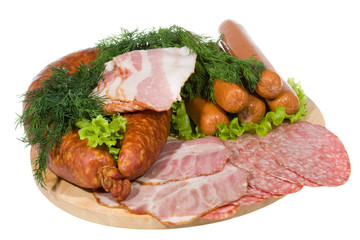 Smoked sausages and meat with salad