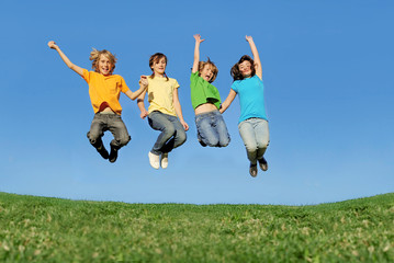 Happy group of kids or children jumping
