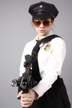Female police officer with a gun.