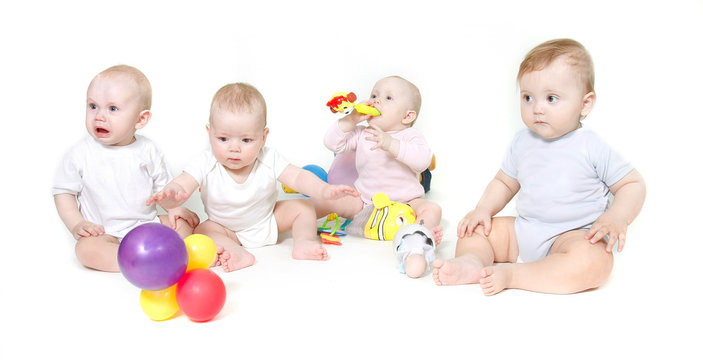 Group Of Babies Over White