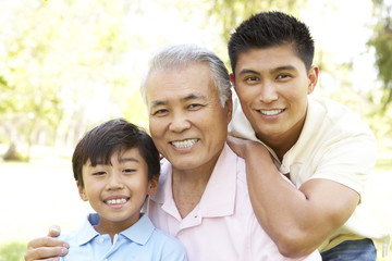 Grandfather With Son And Grandson In Park