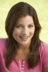 Portrait Of Young Woman In Park