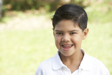 Portrait Of Young Boy In Park