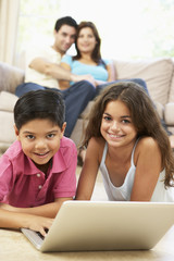 Fototapeta premium Children using laptop At Home