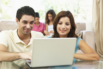 Children Using Laptop At Home