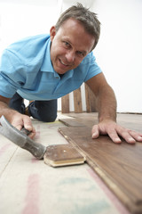 Builder Laying Wooden Flooring