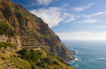 Fototapeta premium A winding road hugs the rugged coastline of South Africa