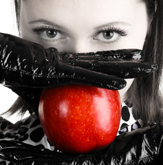 Gorgeous woman holding a red apple