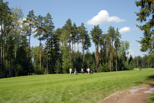 GOLFERS AT COUNTRY CLUB