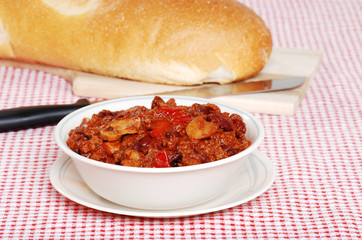 hearty chili with loaf of bread
