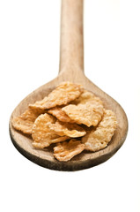 wooden spoon with corn flakes