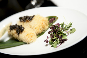 Expensive dish with black caviar