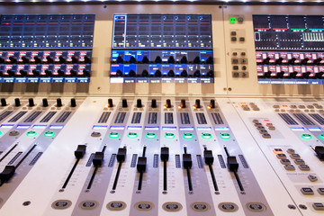 professional audio mixer in a recording studio