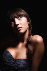 young woman on black background.