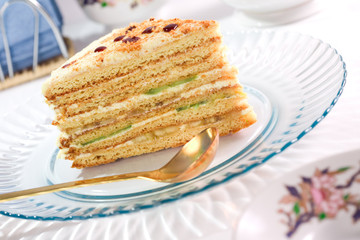 Served slice of fruit layer cake. Close up.