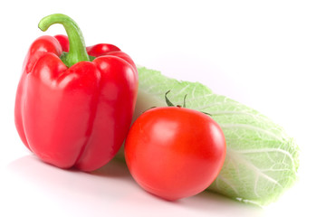 Chinese cabbage, red sweet pepper and ripe tomato on white backg