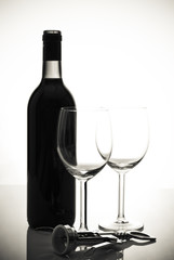 bottle of wine and wineglasses on white background
