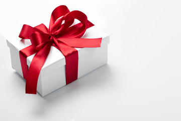 Gift decorated with a tape and a bow