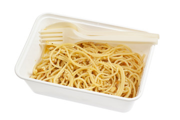 Takeaway spaghetti Aglio e Olio in a container isolated on white