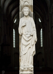 Fototapeta premium Man of a God. Entrance of the XIII century church. France.