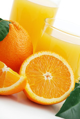 Orange with orange juice and the cut slices
