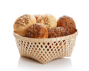 Buns with sesame in a woven basket
