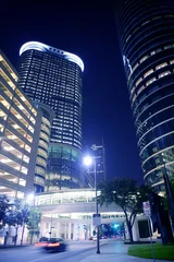 Fotobehang Blue night city lights and buildings in Houston © lunamarina