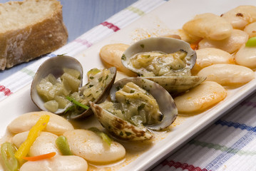 Clams and beans stew. Spanish cuisine. Judiones con almejas.