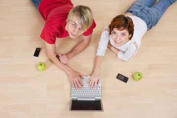 Fototapeta na wymiar Couple playing on computer