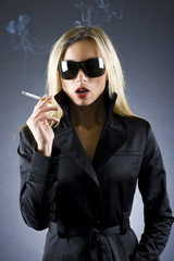 blond woman holding a cigarette