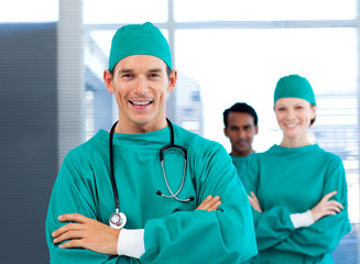 A diverse group of surgeon smiling at the camera