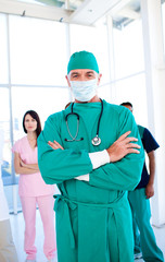 Charismatic surgeon wearing a surgical mask