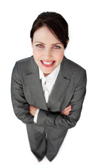 Portrait of a sparkling businesswoman with folded arms