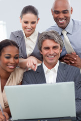 Fototapeta premium A business team showing ethnic diversity using a laptop