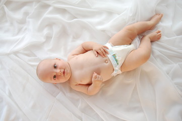 Obraz na płótnie Canvas Cute Baby on a white blanket