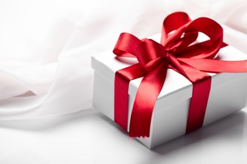 Gift decorated with a tape and a bow