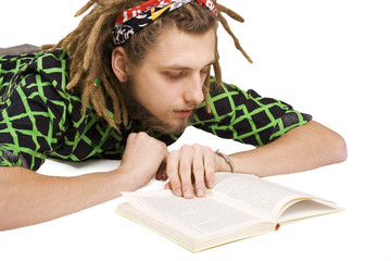 young dreadlock man reading book isolated
