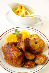 Roasted duck served with orange sauce