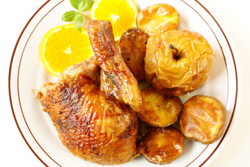Roasted duck with baked potatoes and apples