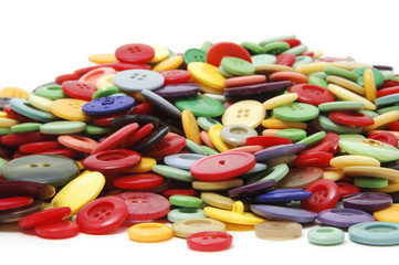 buttons of many colors on a white background