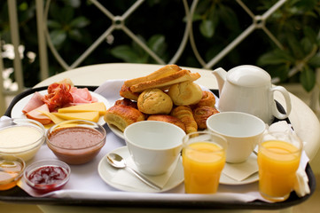 Tasty breakfast for two on the balcony or in the garden