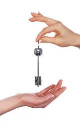 The hand holds a key from the house
