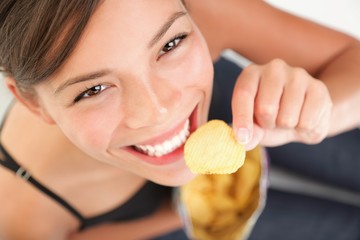 Beautiful woman eating junk food - 19636480