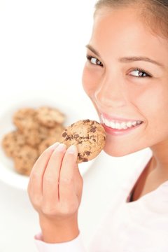 Beautiful Woman Eating Chocolate Chip Cookie