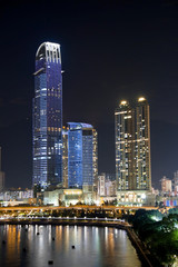 Fototapeta na wymiar Business Towers and Apartment Buildings in Hong Kong at Night.