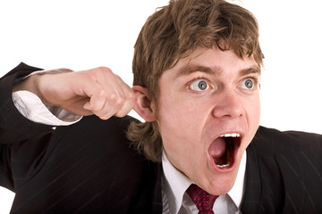 Businessman hold hand near ear. Isolated.